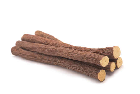 Licorice roots isolated on white backgroundの写真素材