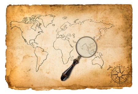 Old map with wind rose and magnifying glass isolated on whiteの写真素材