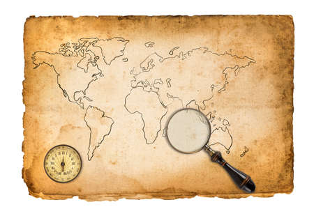 Old map with compass and magnifying glass isolated on whiteの写真素材