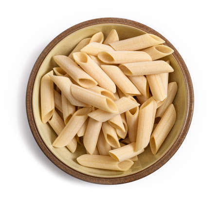 Penne smooth pasta in a plate isolated on white backgroundの写真素材
