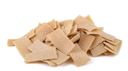 Maltagliati pile pasta isolated on white backgroundの写真素材