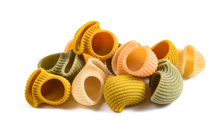 Lumaconi  pasta pile isolated on white backgroundの写真素材