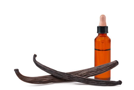 Vanilla sticks with essence bottle isolated on white backgroundの写真素材