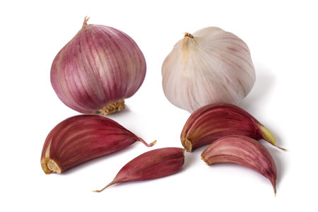 Garlic cloves and bulbs  isolated on white backgroundの写真素材