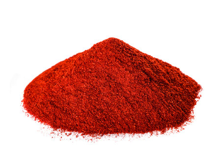 Chili peppers powder pile isolated on white backgroudの写真素材