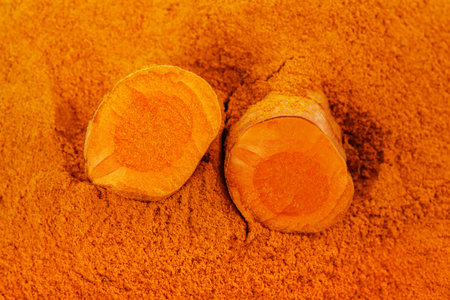 Curcuma roots on curcuma  powderの写真素材