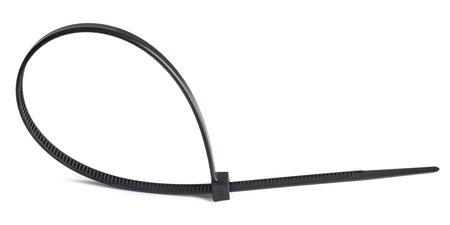 Black plastic cable ties isolated on whiteの写真素材