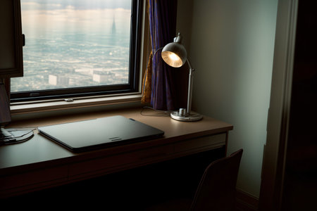 A Laptop Computer Sitting On Top Of A Desk Next To A Window. Generative AIの素材