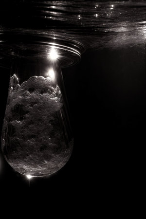 A Black And White Photo Of A Drop Of Water. Generative AIの素材