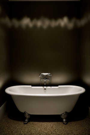 Foto de A White Bath Tub Sitting In A Bathroom. Generative AI - Imagen libre de derechos