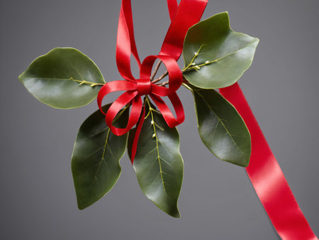 A Red Ribbon Tied To A Green Leaf. Generative AIの素材