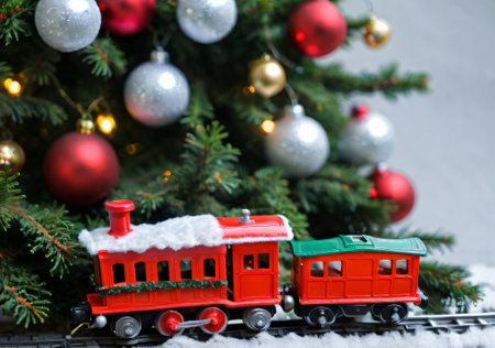 A Christmas Toy Train Under A Tree, With A Front Angle. Generative AIの素材