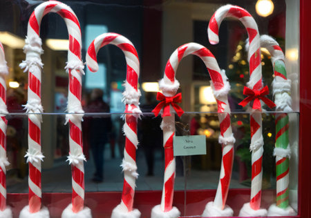 A Christmas Candy Cane Display In A Shop Window, With Soft Lighting. Generative AIの素材