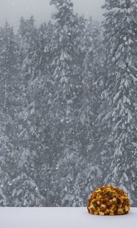 A Christmas Cheese Ball, Set Against A Backdrop Of A Snowy Forest, Visible Through A Cabin Window, At Dusk. Generative AIの素材
