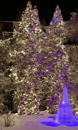 A Festive Fountain Surrounded By Snowy Topiaries Adorned With Lights. Generative AIの素材