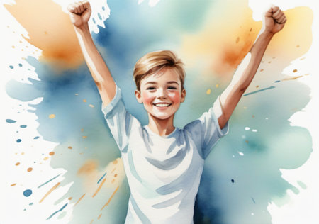 Portrait of a happy boy with arms raised against a watercolor backgroundの素材