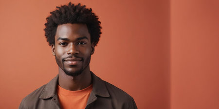 Photo Of A Carefree African American Male Model With A Brown Hair Isolated On A Flat Blurred Orangered Background With Copy Space, Banner Template. Generative AIの素材
