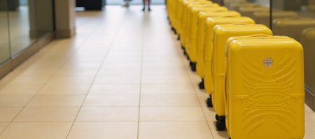 Row of yellow suitcasesの素材