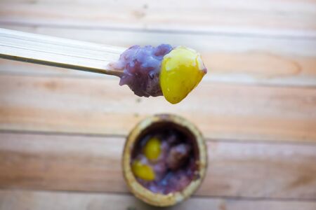 Glutinous rice roasted in bamboo joints