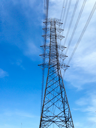 Electric post with blue sky backgroundの写真素材
