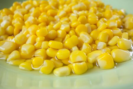 Corn put in the green bowl close upの写真素材