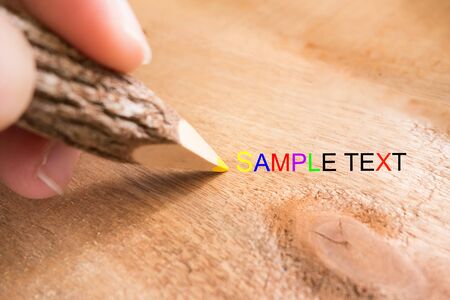 wooden colored pencil write on the wood tableの写真素材