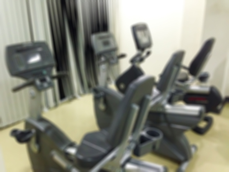 Blur stationary bike in the fitness roomの写真素材