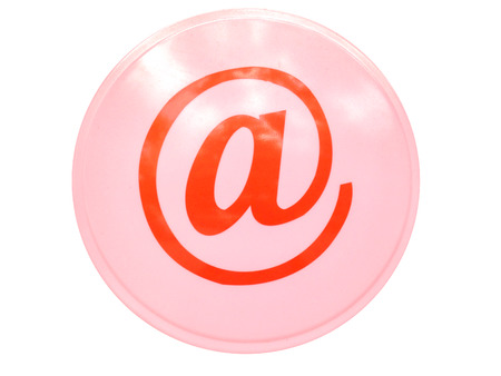 The red arroba symbol on the pink cycle background isolatedの写真素材