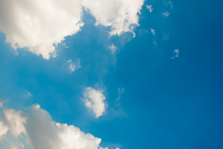 Blue sky with white cloud backgroundの写真素材