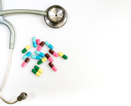 Tablet medicine and stethoscope on the white backgroundの写真素材
