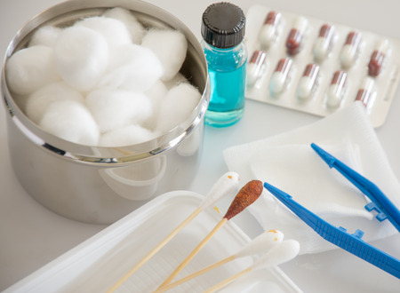 First aid kit for bandaging on wood ,white backgroundの写真素材
