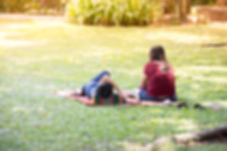 Blur Asian couple relaxed by chillout in the garden for backgroundの写真素材