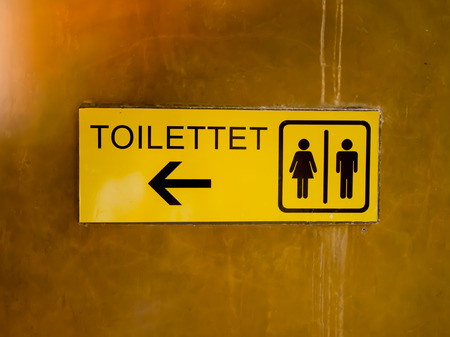 The Toilet sign and direction on the wallの写真素材