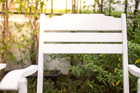 Close up white chair in the garden with sunlightの写真素材