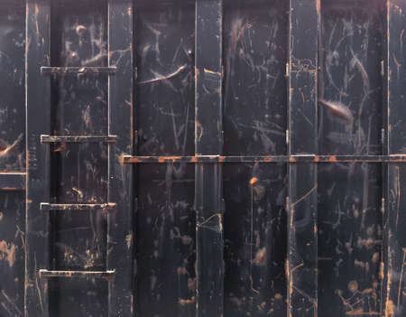 Background image - Side view of a damaged metal containerの写真素材