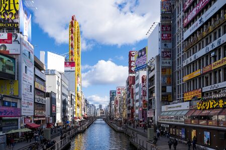 Osaka, Japan - December 30, 2018: Dotonbori the famous place in Osaka, Japan. Tourist walking in night shopping street at Dotonbori, the famous destination for traveller in Osaka, Japanのeditorial素材