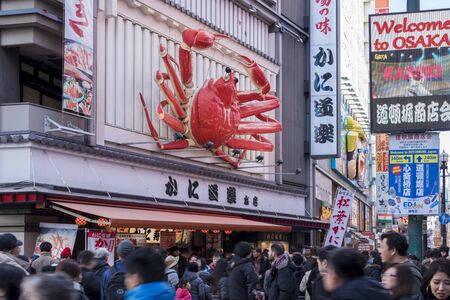 Osaka, Japan DECEMBER 30, 2018: Dotonbori district of Osaka, Japan. Dotonbori district is the most famous tourist destination in Osaka, Japan. Crab logo restaurants are located in Dotonbori district.のeditorial素材