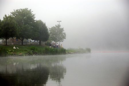 walking around foggy lake  in early morningの写真素材