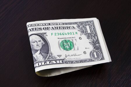 One dollar on table. Finance concept