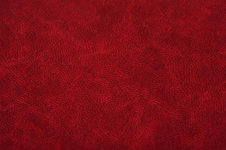 Red leather texture close up.の写真素材