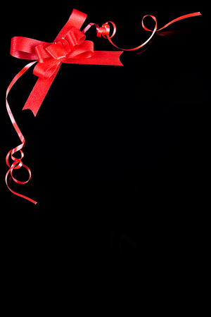 Red ribbon border on black backgroundの写真素材