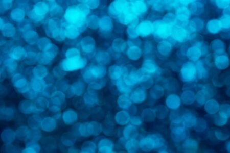 Luxury bokeh background. Blue shiny christmas lights background. Text space