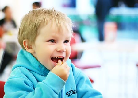 Little boy eat on cafeの写真素材