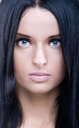 Mystical portrait of beautiful young woman with perfect skin and black hairの写真素材