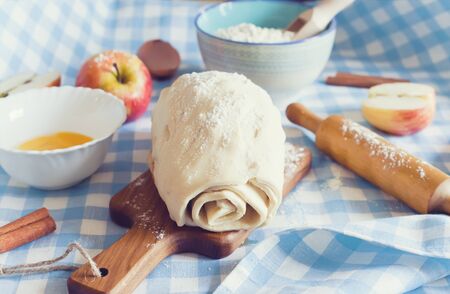 Homemade apple strudel with cinnamon, raw doughの写真素材