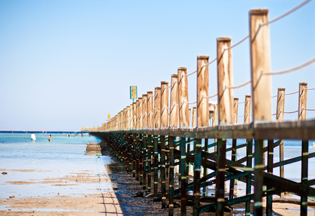 Wooden pontoon in tropical seaの写真素材