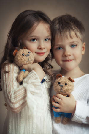 Happy twins boy and girl closeup portraitの写真素材