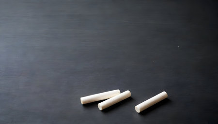 An array of colored chalk lines up against a dark slate background, presenting a spectrum of possibilities for artistic expression.の素材