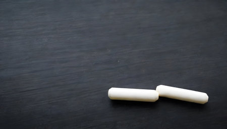 An array of colored chalk lines up against a dark slate background, presenting a spectrum of possibilities for artistic expression.の素材