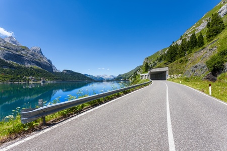 Summer view of Fedaia lake beneath Marmolada mountain の写真素材